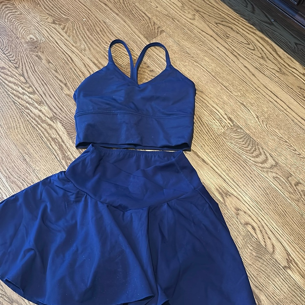 Halara two piece swirl skirt with v front and matching tank top